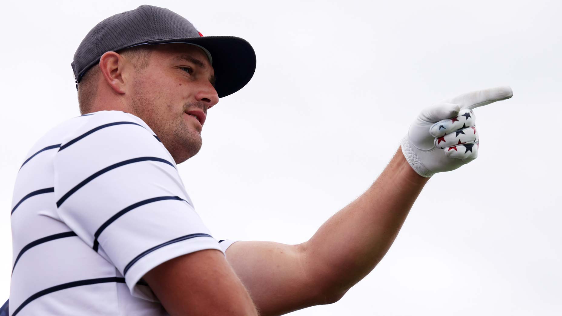 Brooks Koepka uses a dartboard with a picture of Brandel Chamblee on it for target practice