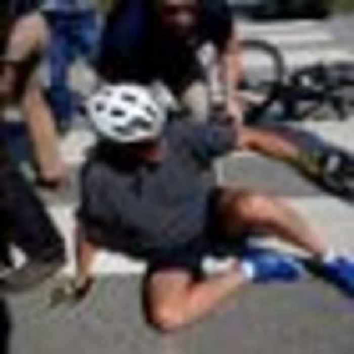 Joe Biden falls while getting off his bike after getting his 'foot caught' following beach ride with wife Jill | US News | Sky News